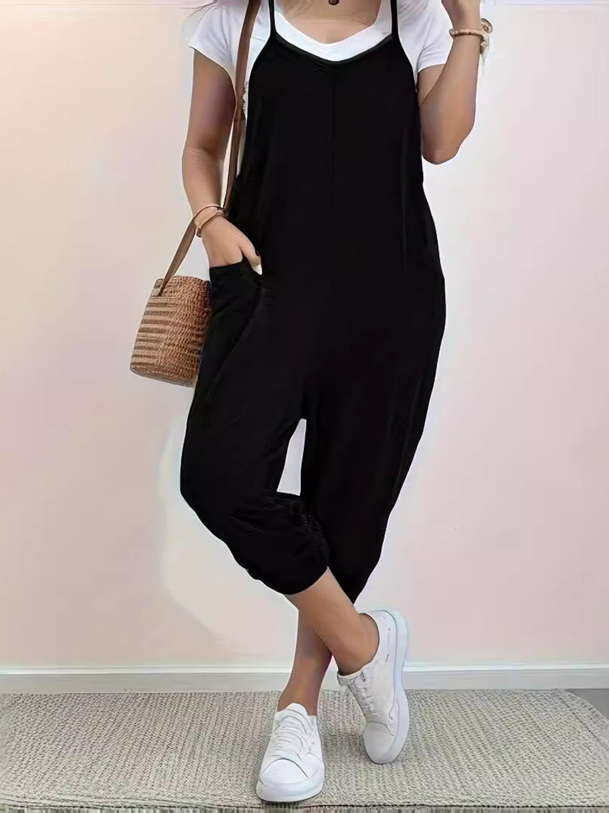 Casual loose-fit spaghetti strap jumpsuit with pockets from Plush Fashion Hub, shown in a relaxed style on a model.