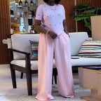 Heart print round neck top and wide-leg pants set by eprolo, featuring a stylish top with a heart pattern and matching wide-leg pants.
