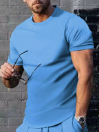 Plus size men's casual T-shirt in solid color, Trendsi brand, featuring a comfortable fit and simple design.