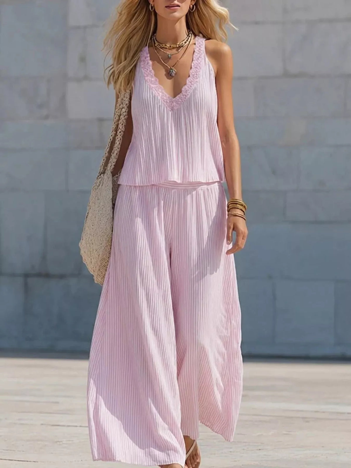 Striped V-neck tank top and wide-leg pants matching set by Plush Fashion Hub, featuring stylish striped pattern and comfortable fit.