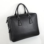 Men's Pi-Mart leather briefcase with cowhide material, large capacity, horizontal design, suitable for professional use.