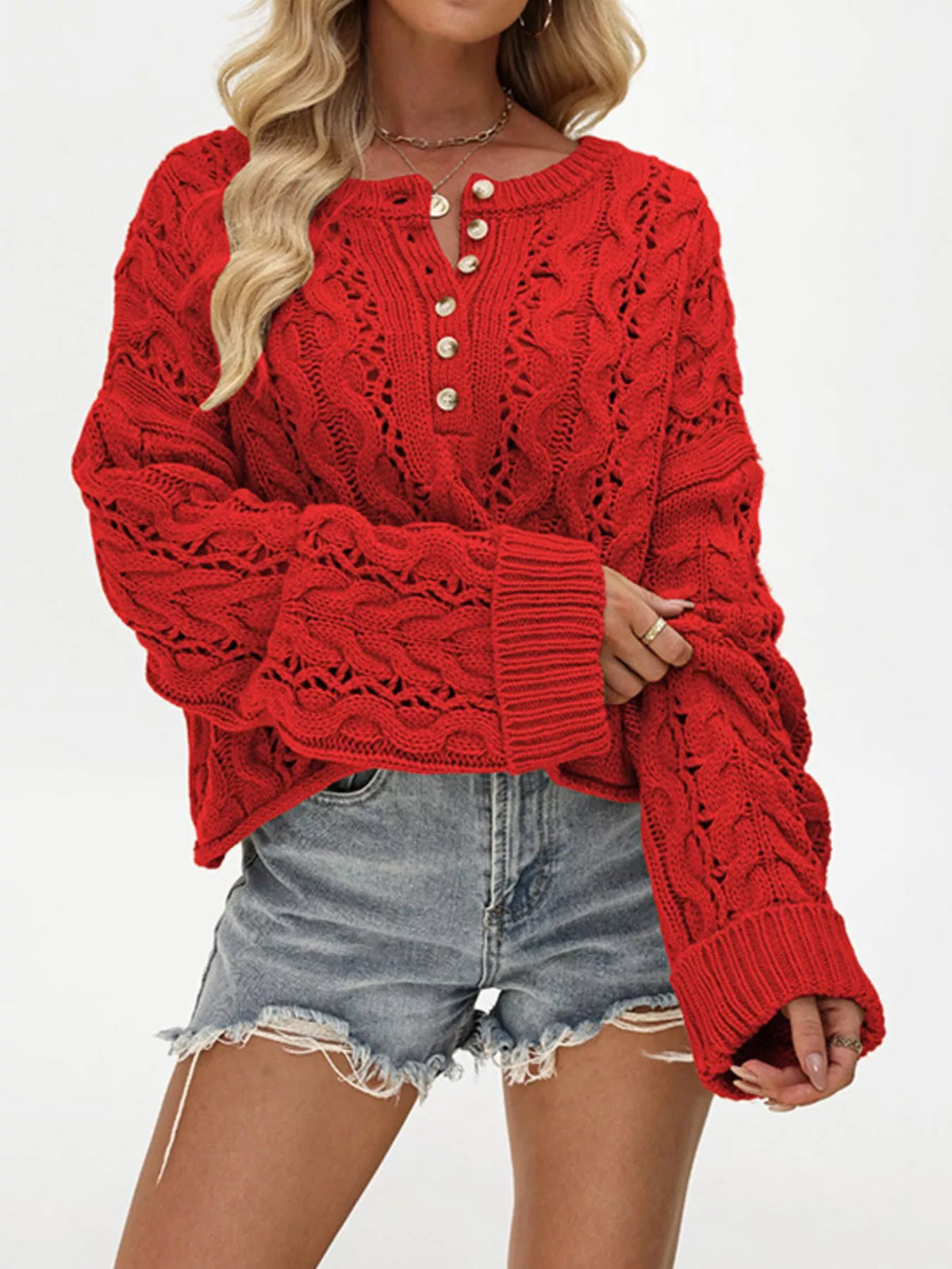 Chic cable knit half-button openwork sweater by Trendsi featuring a cozy design with textured knit and openwork details.