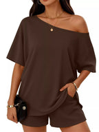 Plus size full size one shoulder top and shorts set by Trendsi featuring a stylish, casual look with a one shoulder design and comfortable fit.