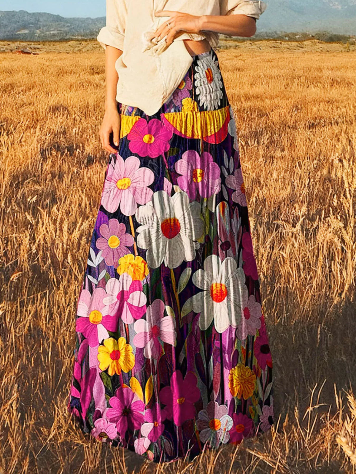 Floral print high-waisted maxi skirt from Trendsi, flowing fabric with vibrant flower design, full length, suitable for casual or dressy wear.