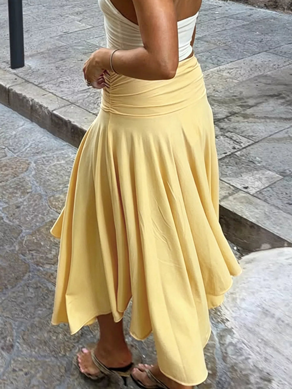 Flowy ruched waist skirt by Trendsi, showcasing a lightweight, elegant skirt with gathered detailing at the waist.