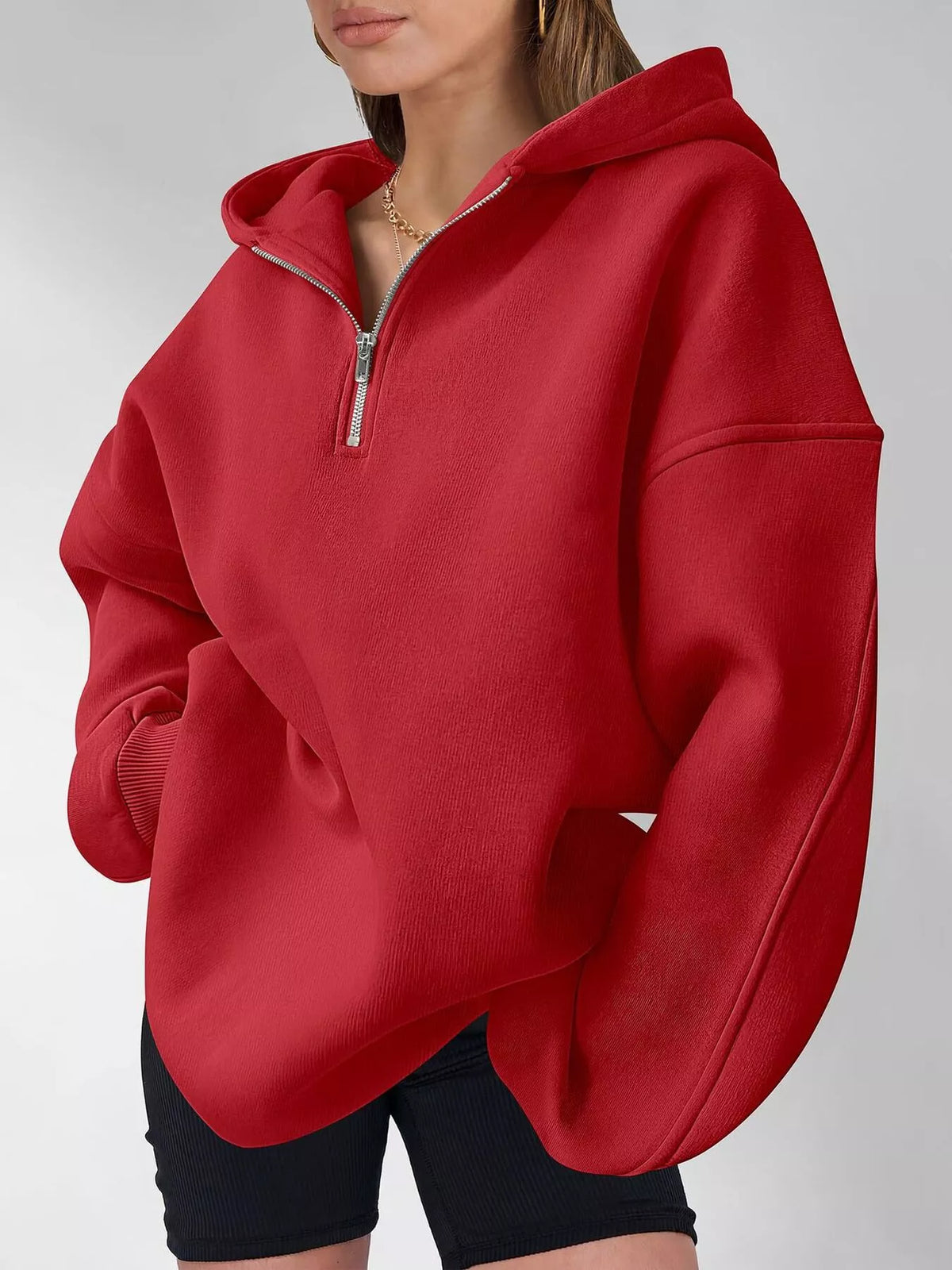 Oversized quarter-zip hoodie from Trendsi, featuring a comfortable fit, soft fabric, and a stylish casual look.