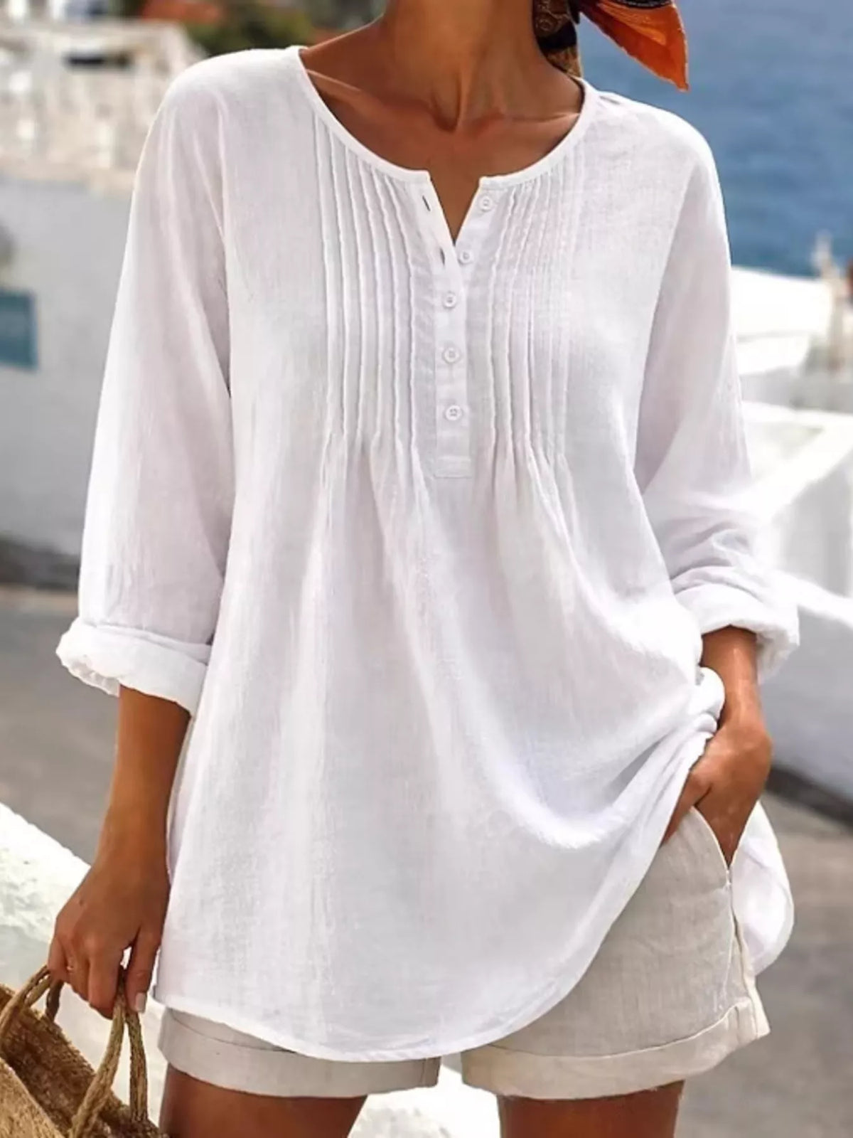 Casual long sleeve linen shirt with button details from Trendsi, featuring a relaxed fit and natural fabric texture.