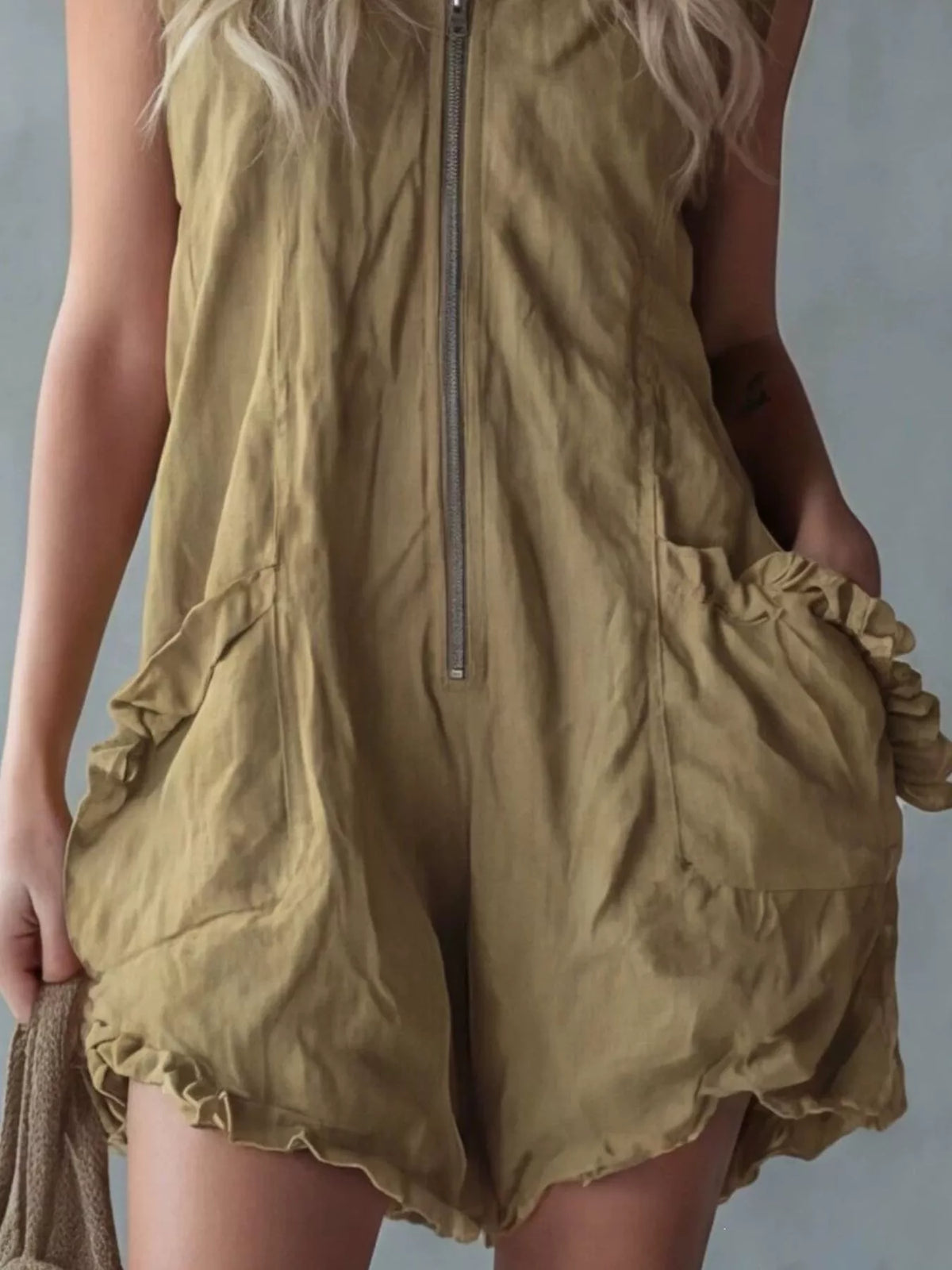 Plus size hooded sleeveless zipper romper with ruffled pockets by Plush Fashion Hub, shown in full size with ruffle details and pockets.