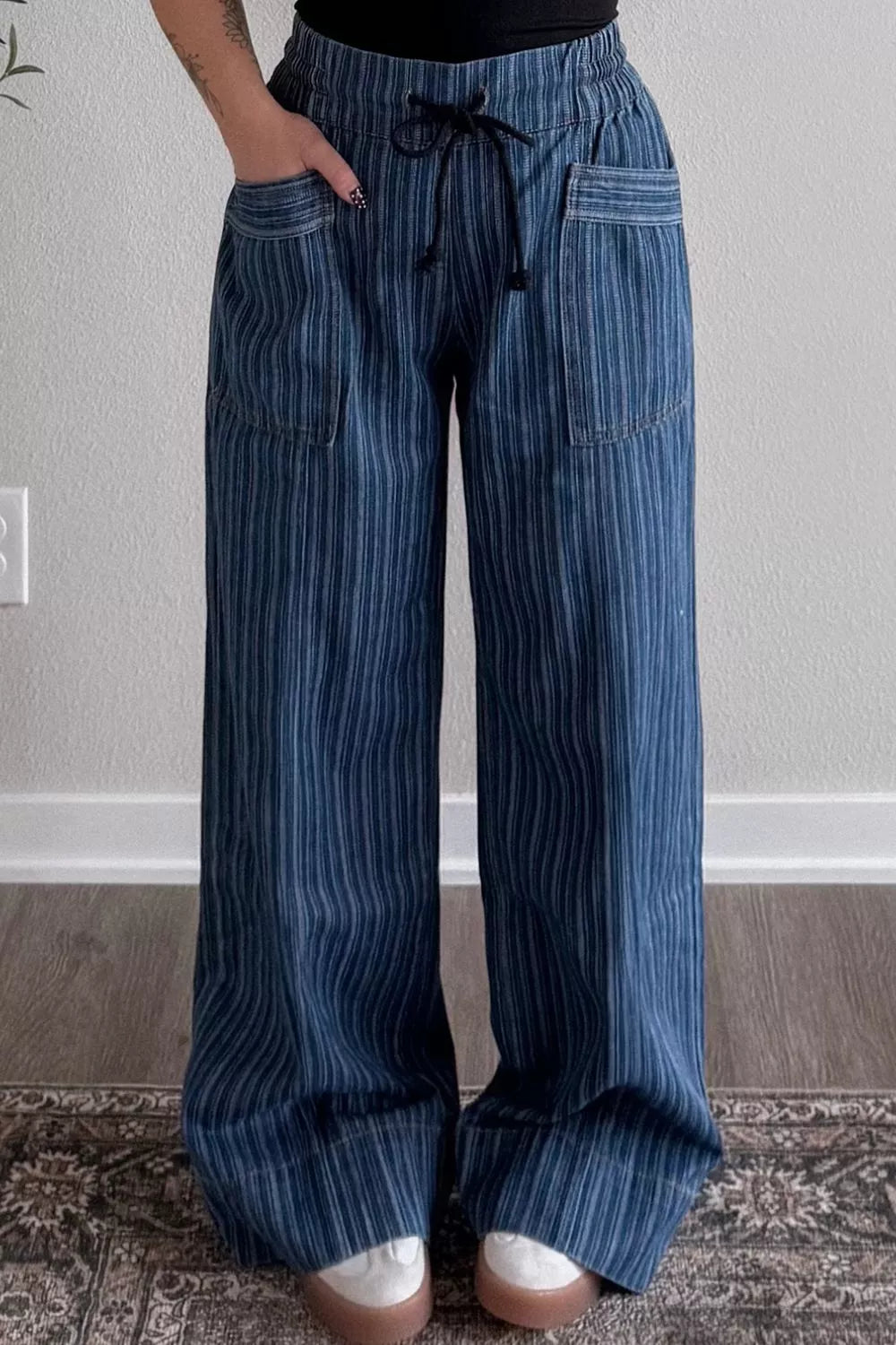 Striped wide-leg denim jeans by Plush Fashion Hub featuring a stylish pattern and relaxed fit, displayed on a model.