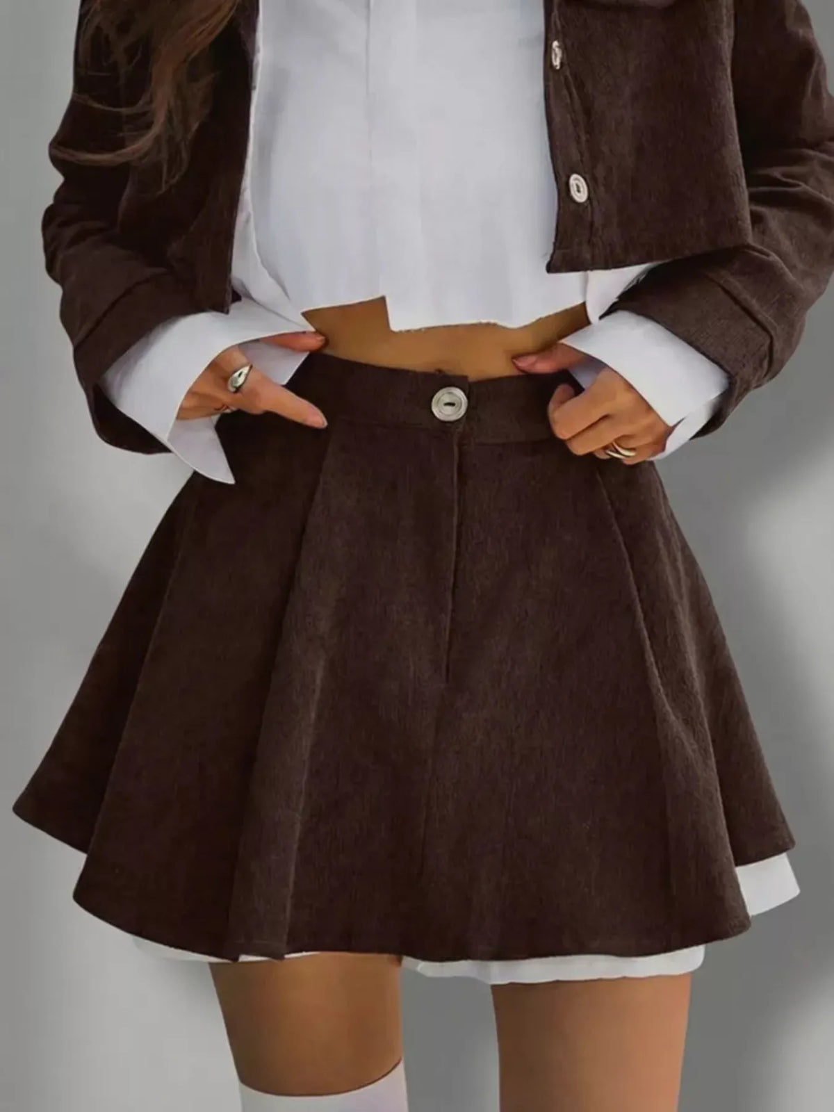 Trendsi button-up cropped jacket and mini skirt set, stylish matching skirt and jacket, black fabric, front buttons, modern design