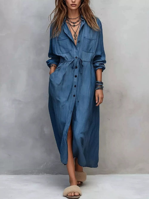 Plus size button-front long sleeve shirt dress by Trendsi, shown in full length with a collar and relaxed fit.