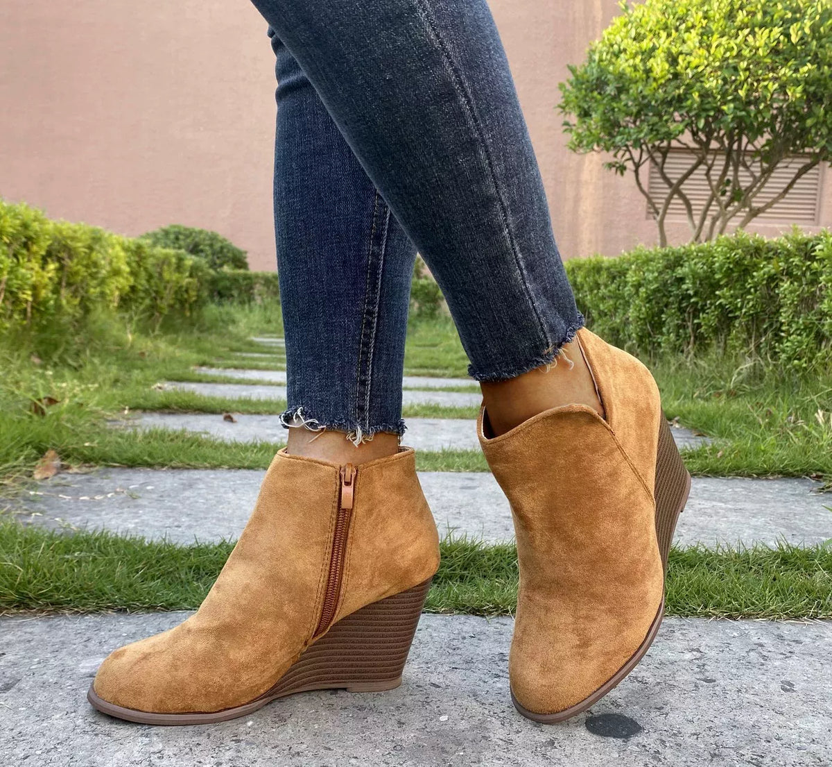 Round toe wedge ankle boots in black leather from Trendsi, featuring a chunky heel and stylish ankle strap.
