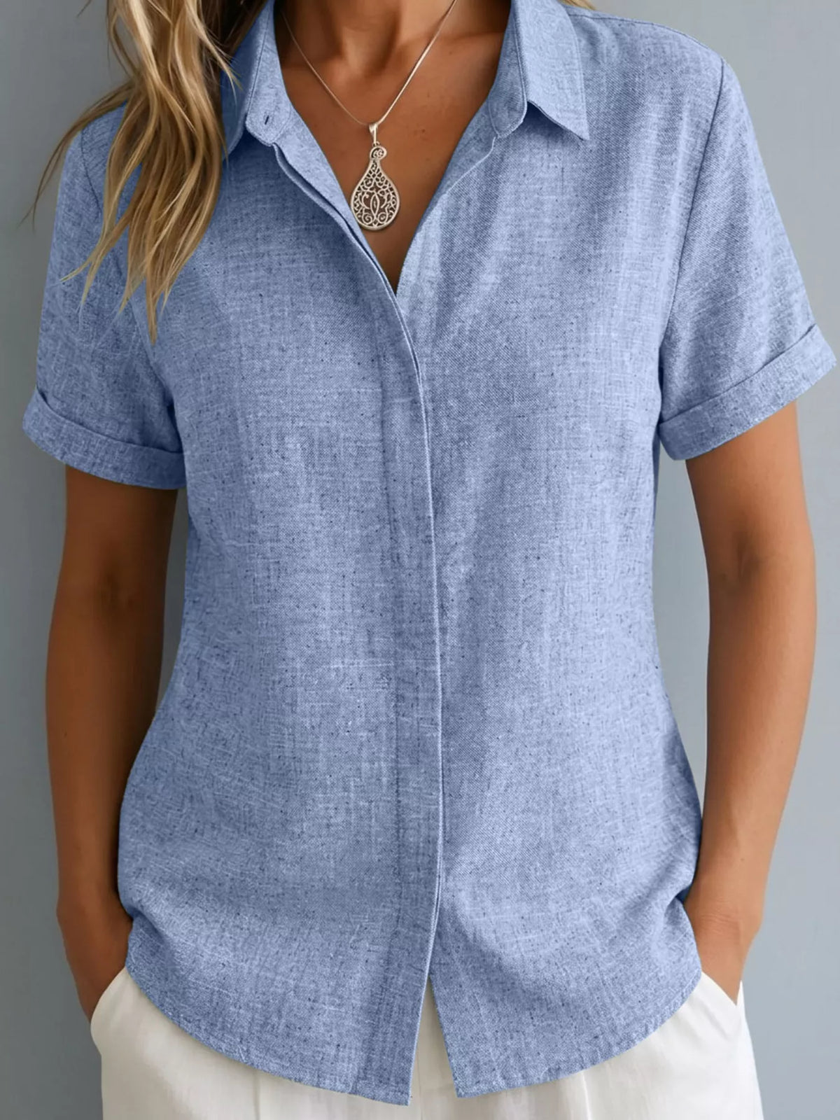 Plus size collared short sleeve shirt from Trendsi, featuring a button-up design and classic collar, full-size top for women.