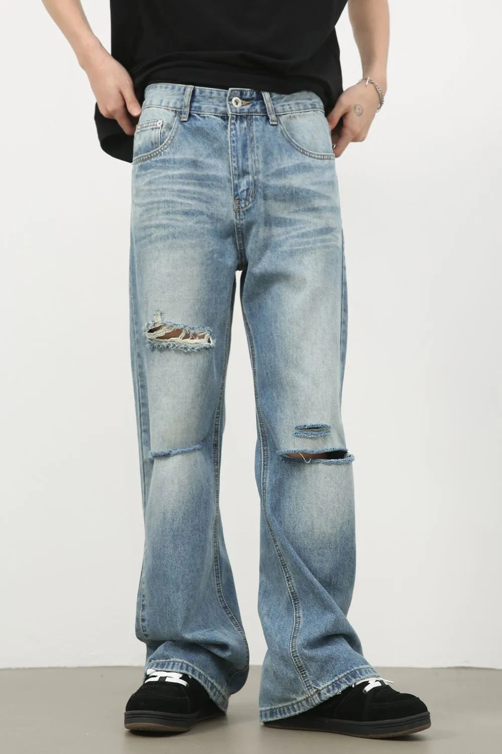 Men's distressed denim jeans by Plush Fashion Hub featuring a classic fit with ripped details and a faded blue wash.