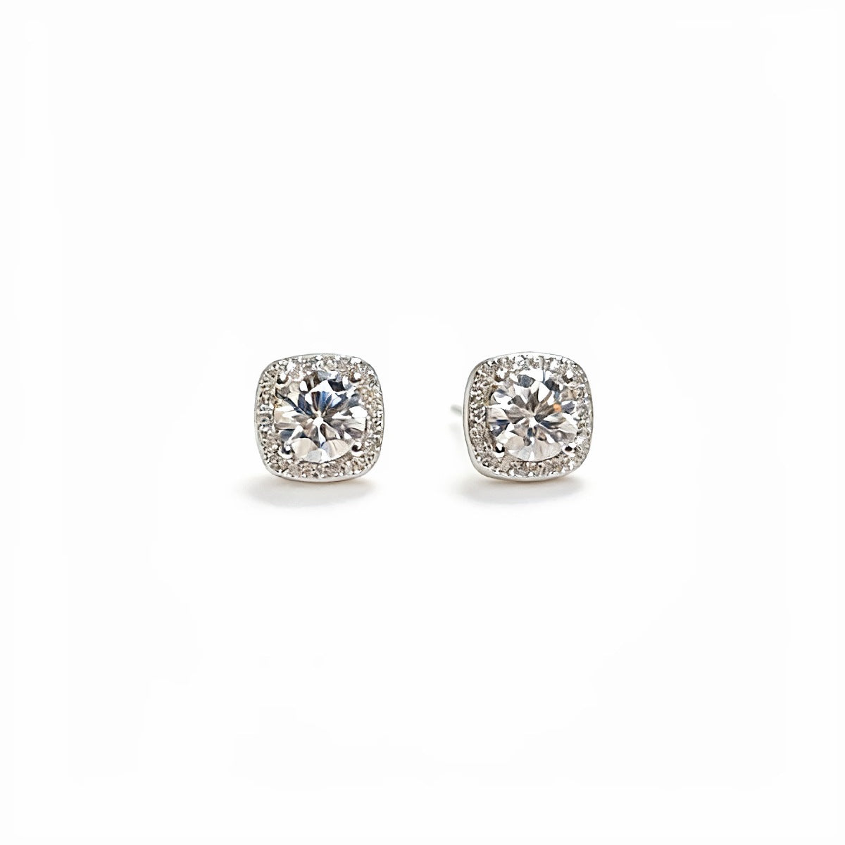 Sterling silver stud earrings with 1-carat moissanite gemstones, featuring a classic and elegant design.