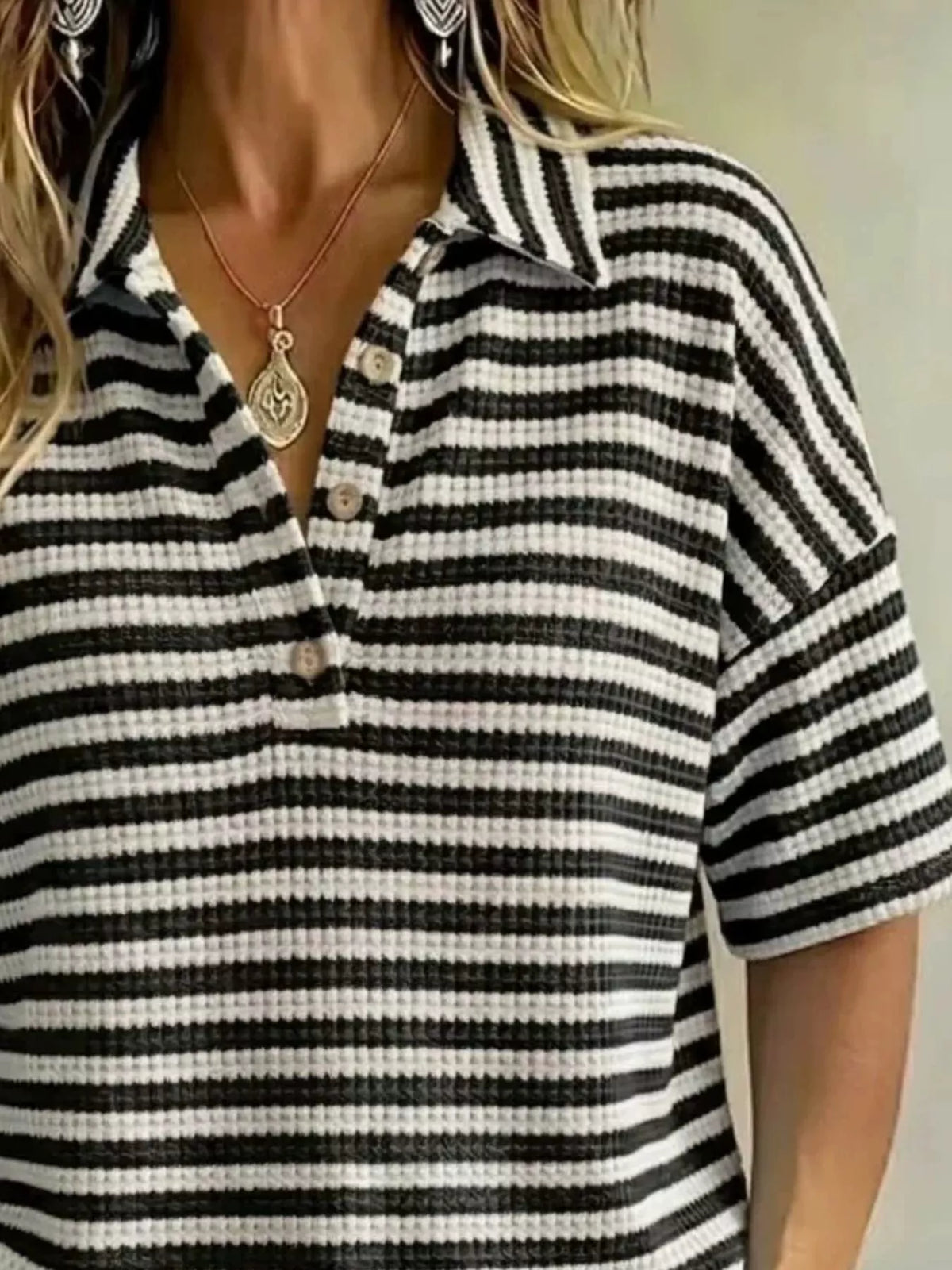 Plus size contrast striped knit polo shirt from Trendsi, featuring a full-size women's top with bold stripe details.