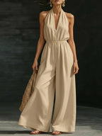 Women’s V-neck halter neck wide-leg jumpsuit by FitiqueFit, casualwear with a stylish V-neck and sleeveless design.