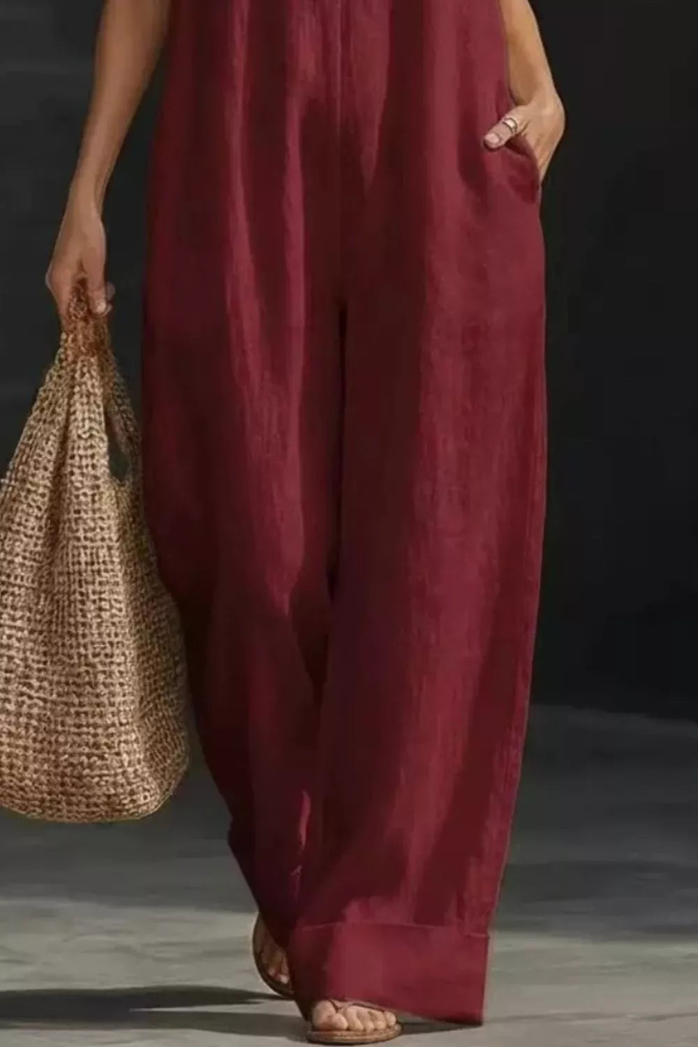 Women's sleeveless wide-leg jumpsuit with pockets from Plush Fashion Hub, casual romper in a relaxed fit.