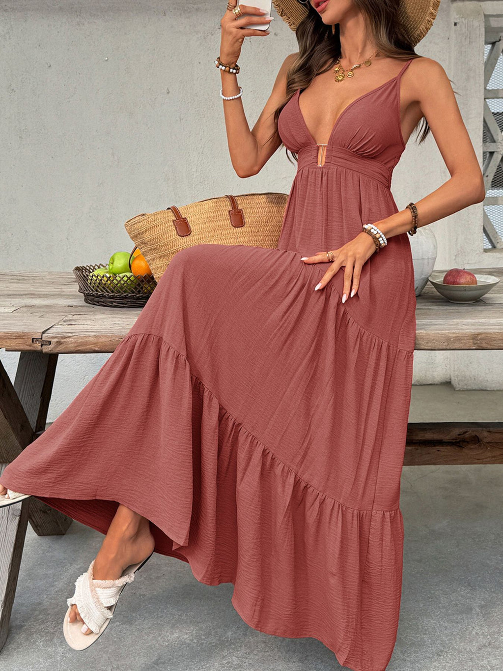 Women's deep V-neck tiered maxi dress by Trendsi, flowy boho beach dress with smocked details and layered design.