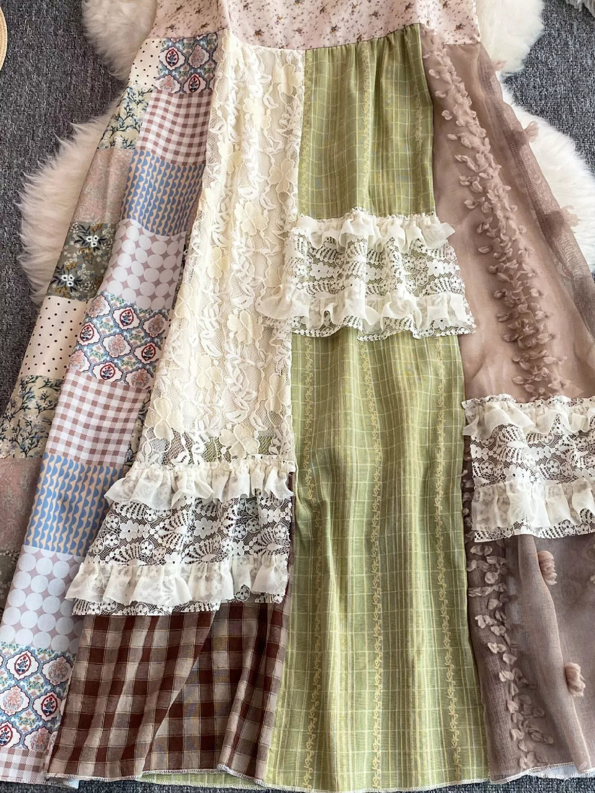 Boho patchwork lace trimmed A-line tiered dress by Plush Fashion Hub, featuring colorful fabric patches and flowing silhouette.
