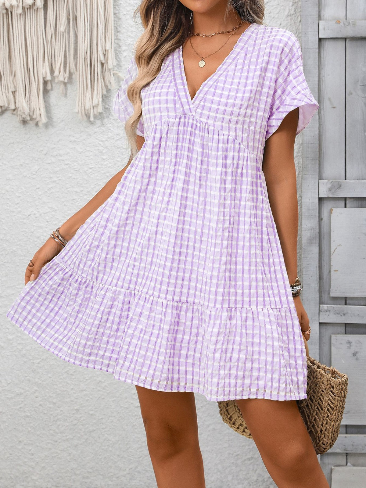 Plush Fashion Hub chic plaid V-neck mini dress with ruffle hem, stylish and trendy for casual or semi-formal occasions.