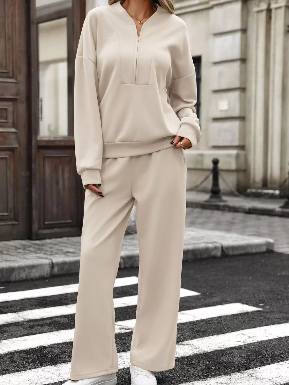 Women’s half zip sweatshirt and wide-leg pants set by Trendsi, casual loungewear with comfortable fit and stylish design.