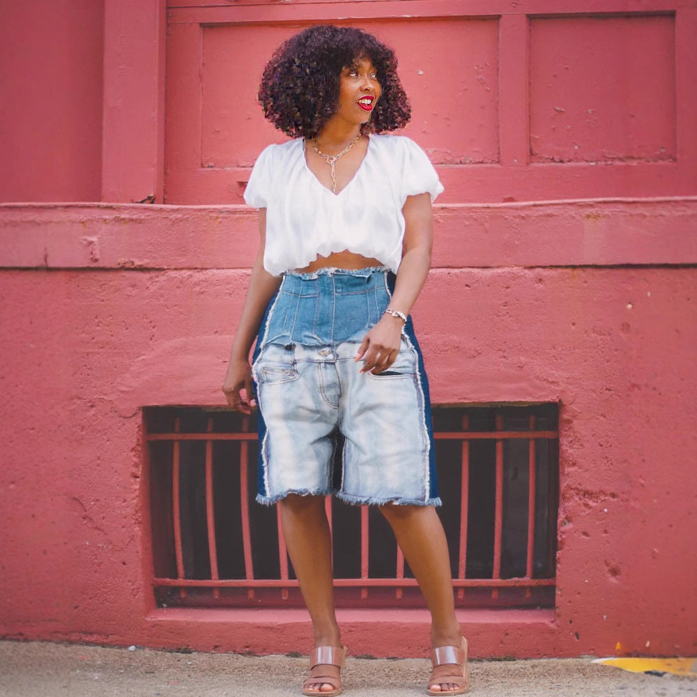 Pair of high-waist distressed patchwork denim jeans from eprolo, featuring ripped details and faded fabric for a trendy look.