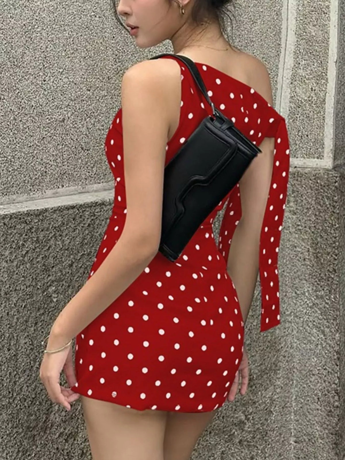 Polka dot sleeveless mini dress with bow accents from Plush Fashion Hub, featuring a stylish and playful design.