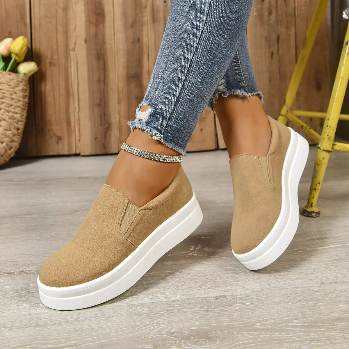 Round toe platform slip-on footwear by Trendsi, featuring a sleek design and comfortable sole, ideal for casual wear.