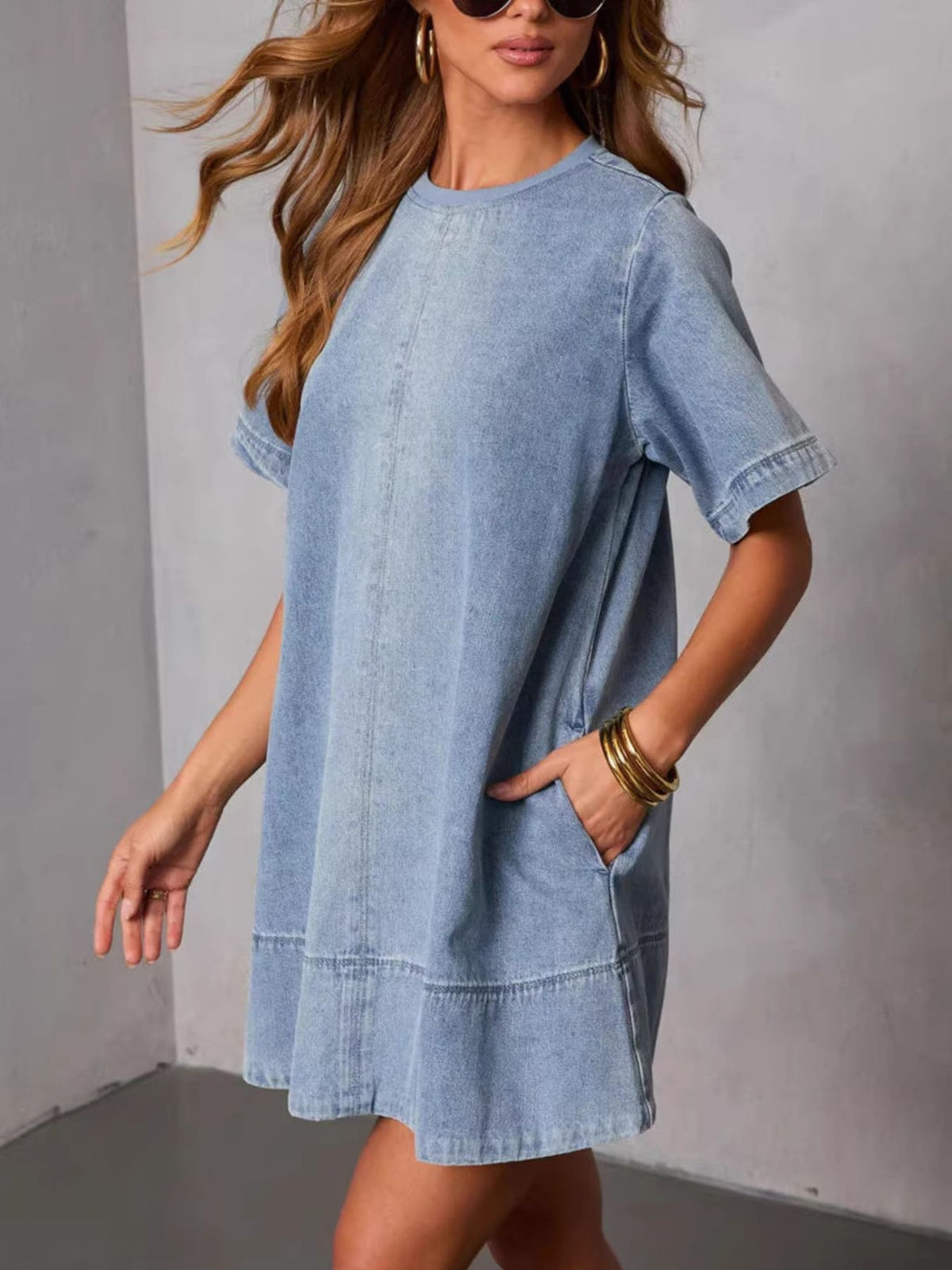 Women’s casual denim dress with short sleeves and pockets by Plush Fashion Hub, displayed on a plain background.