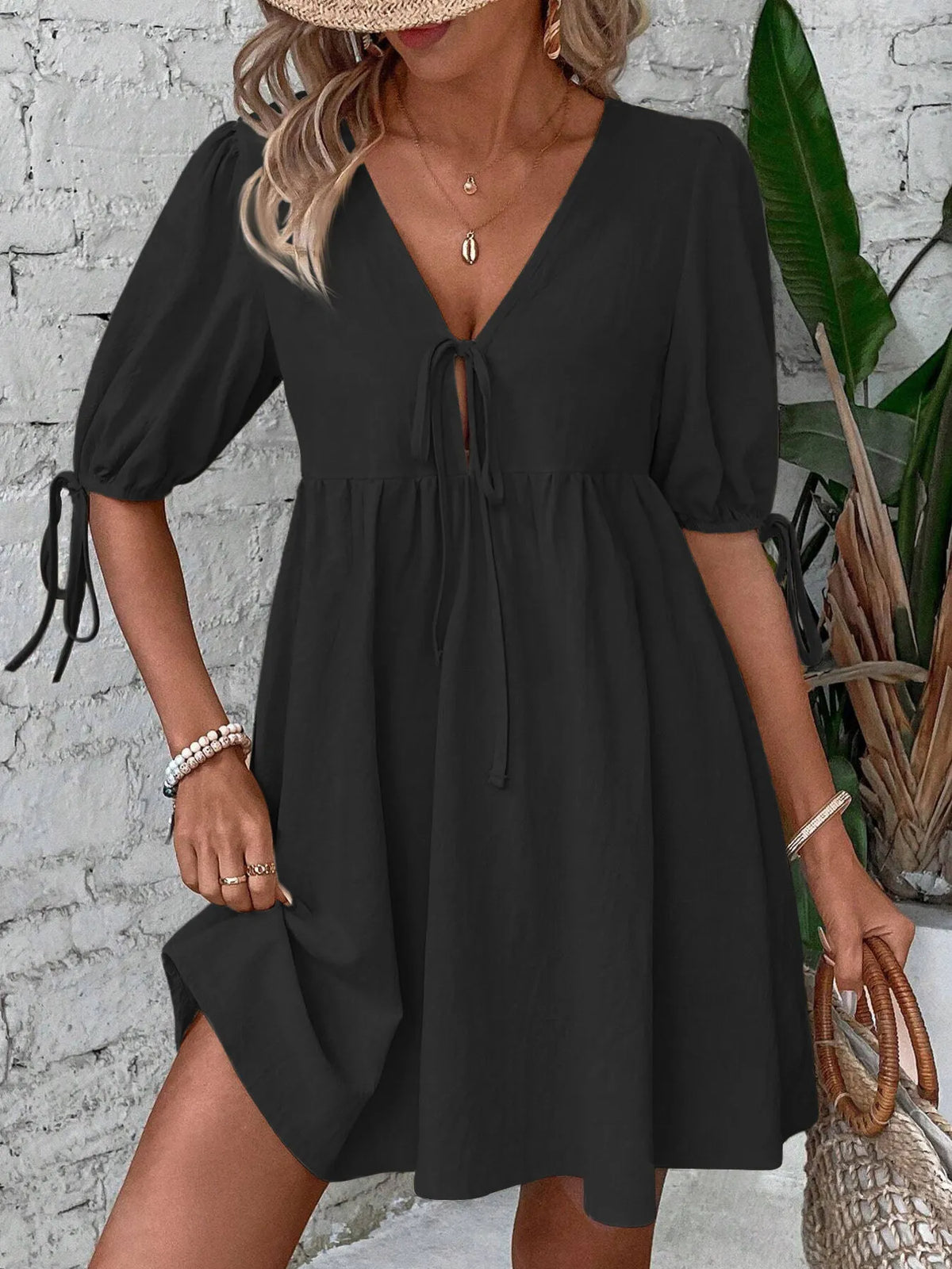 Cotton V-neck tie-front mini dress with puff sleeves by Plush Fashion Hub, featuring a stylish and feminine design.