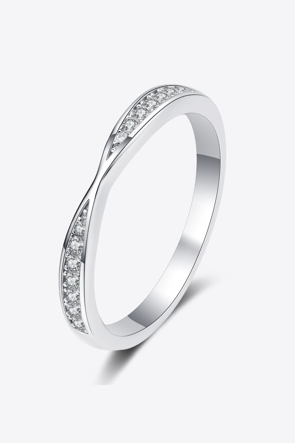 Rhodium-plated moissanite ring with a sparkling centerpiece, showcasing elegant design and fine craftsmanship.