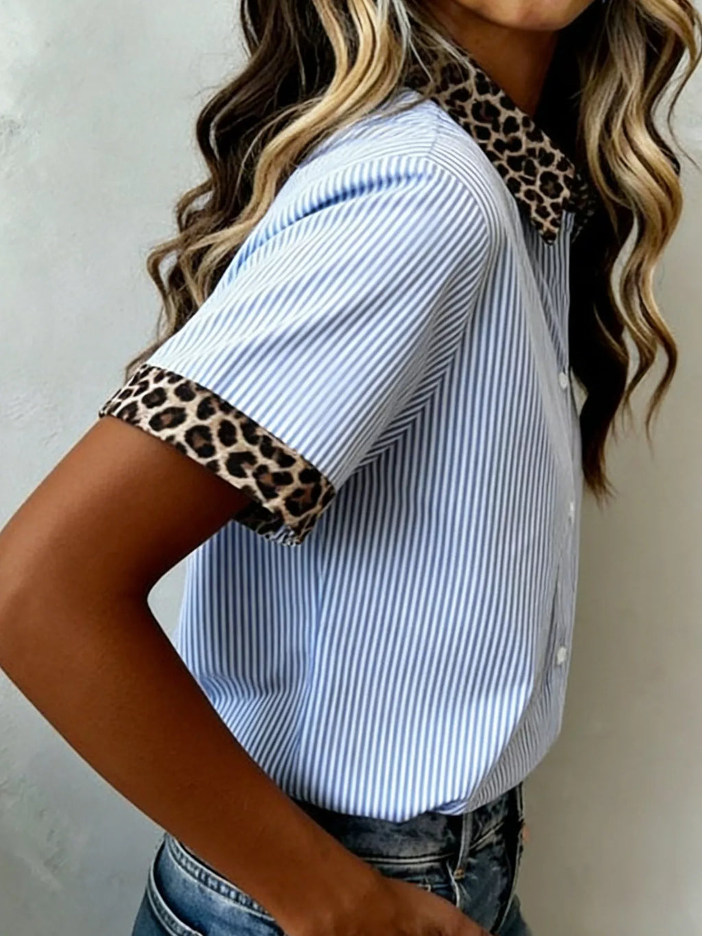 Women's leopard print dress with short sleeves and contrast collar, featuring trendy animal pattern and stylish design.