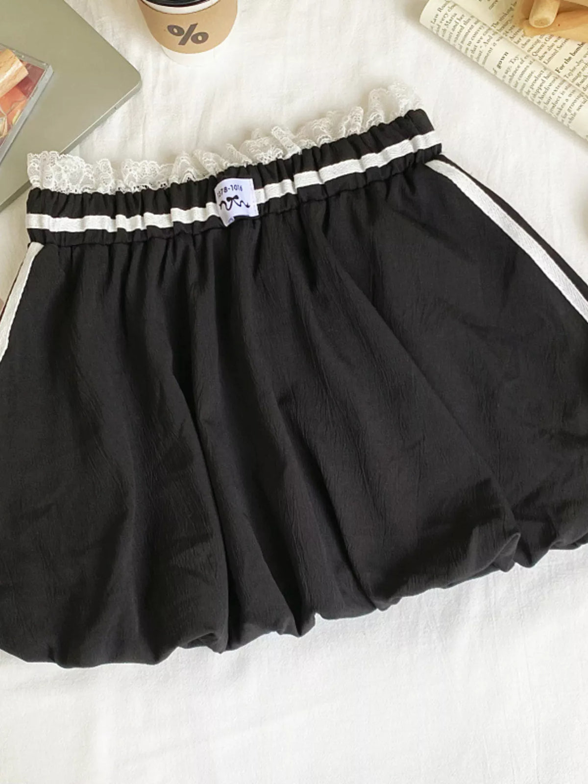 Plush Fashion Hub lace trim elastic waist mini skirt featuring a stylish, fitted design and delicate lace detail at the hem.