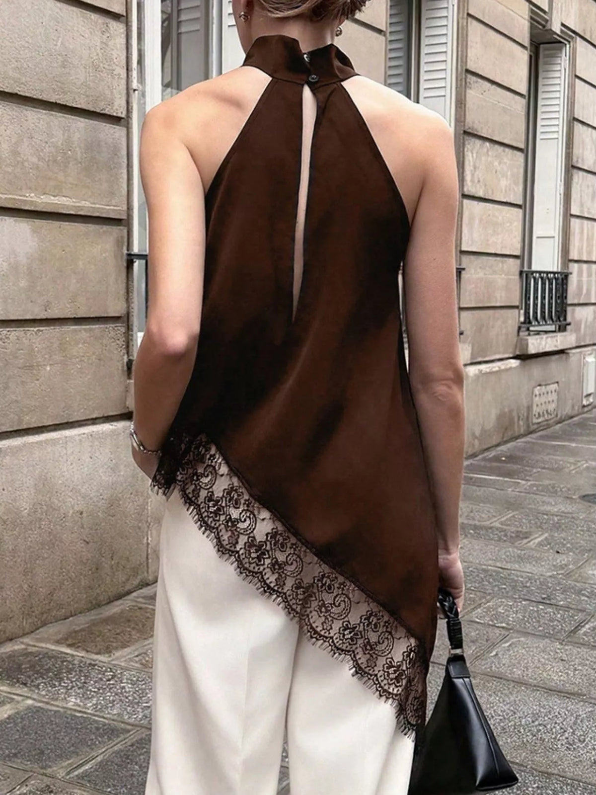 Polka dot lace trim sleeveless blouse with asymmetrical hem from Plush Fashion Hub, featuring a stylish and feminine design.