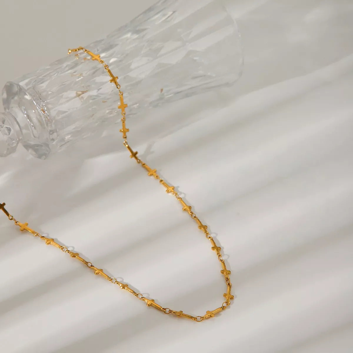 18K gold-plated cross necklace with a sleek chain, stylish jewelry piece from Plush Fashion Hub.