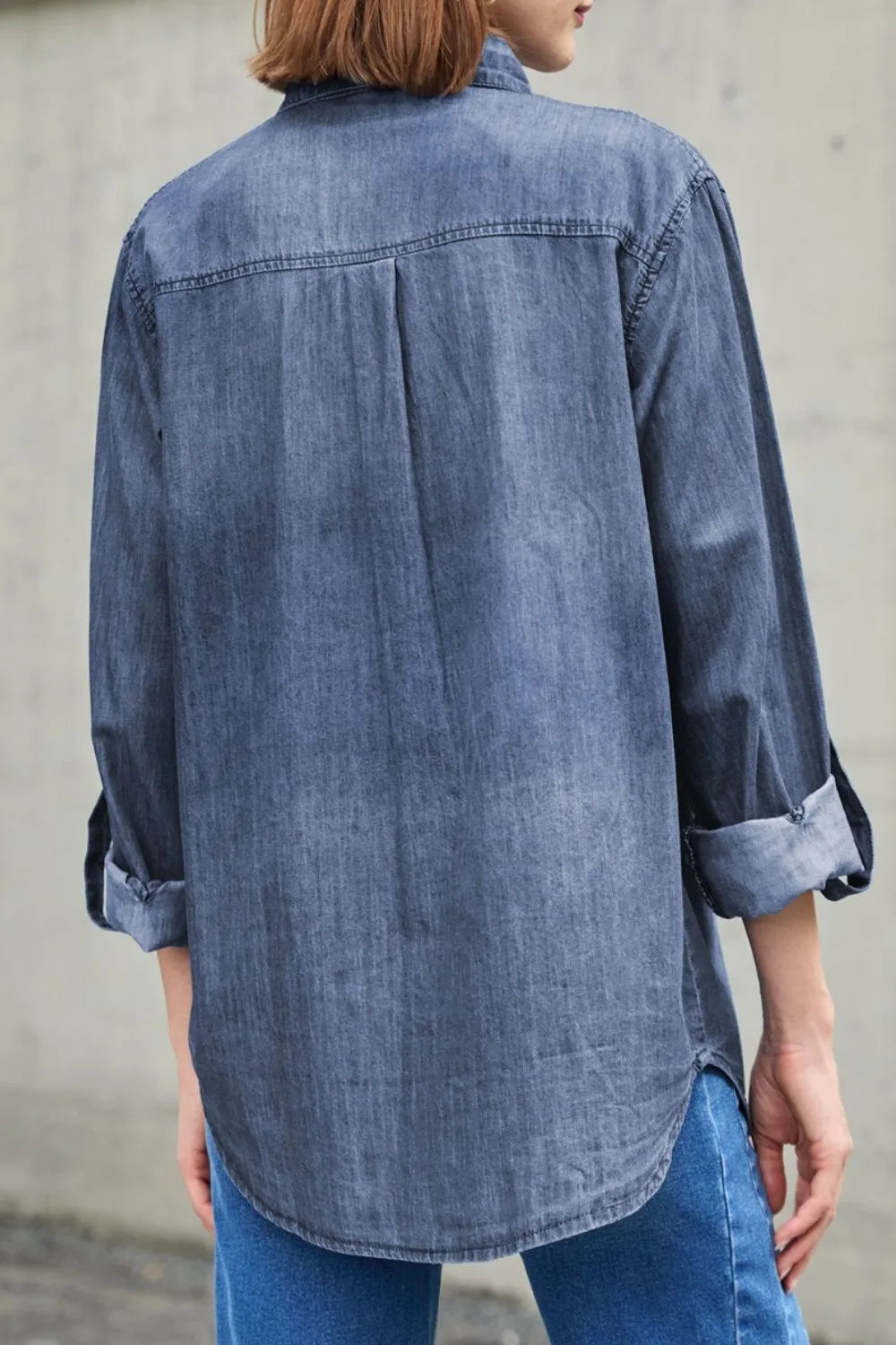 Trendsi denim top with long sleeves, collared neck, and front pockets, made of classic blue denim fabric.
