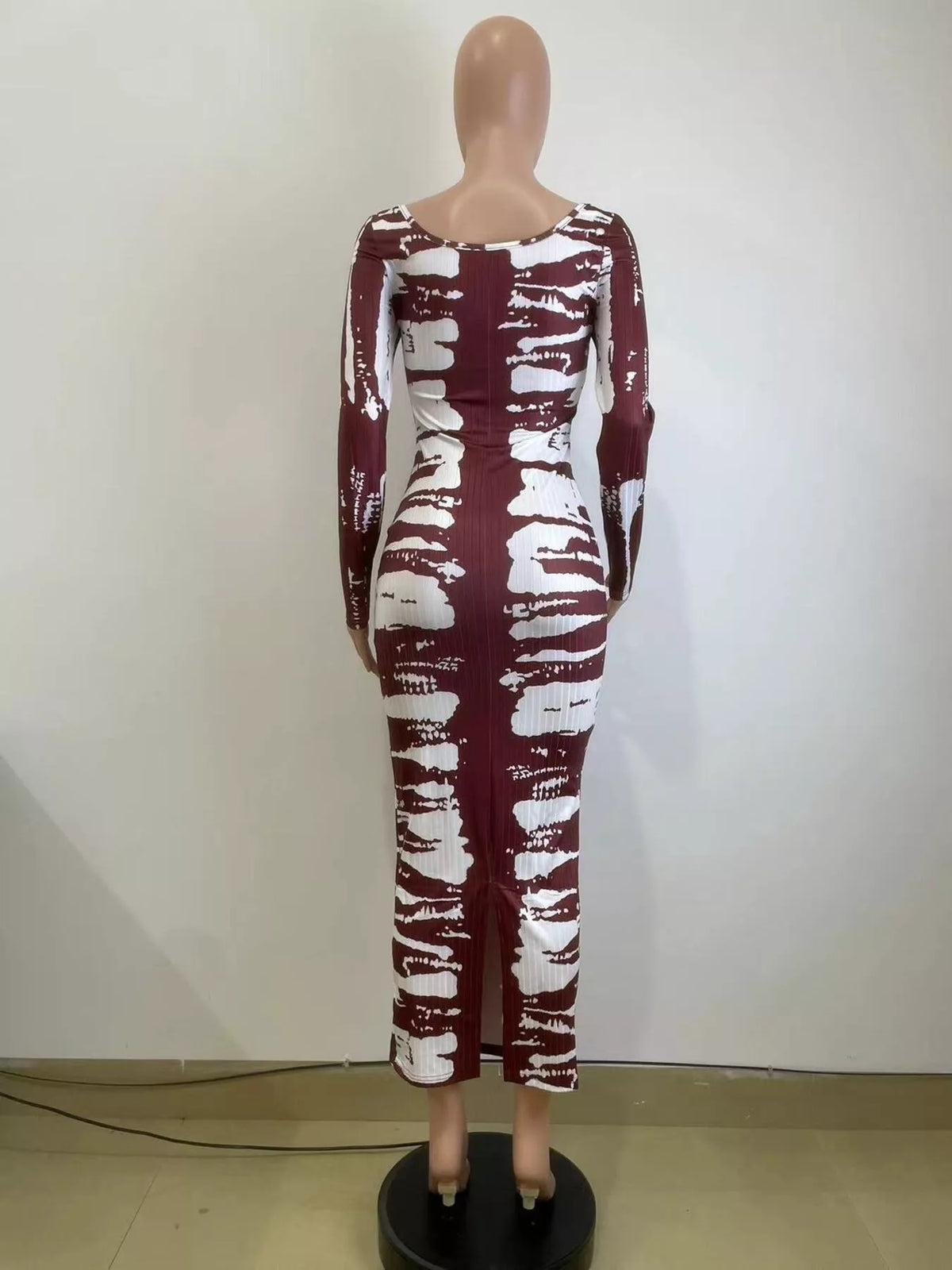 Colorful tie-dye long sleeve maxi dress by Plush Fashion Hub, featuring a flowing silhouette and vibrant pattern.