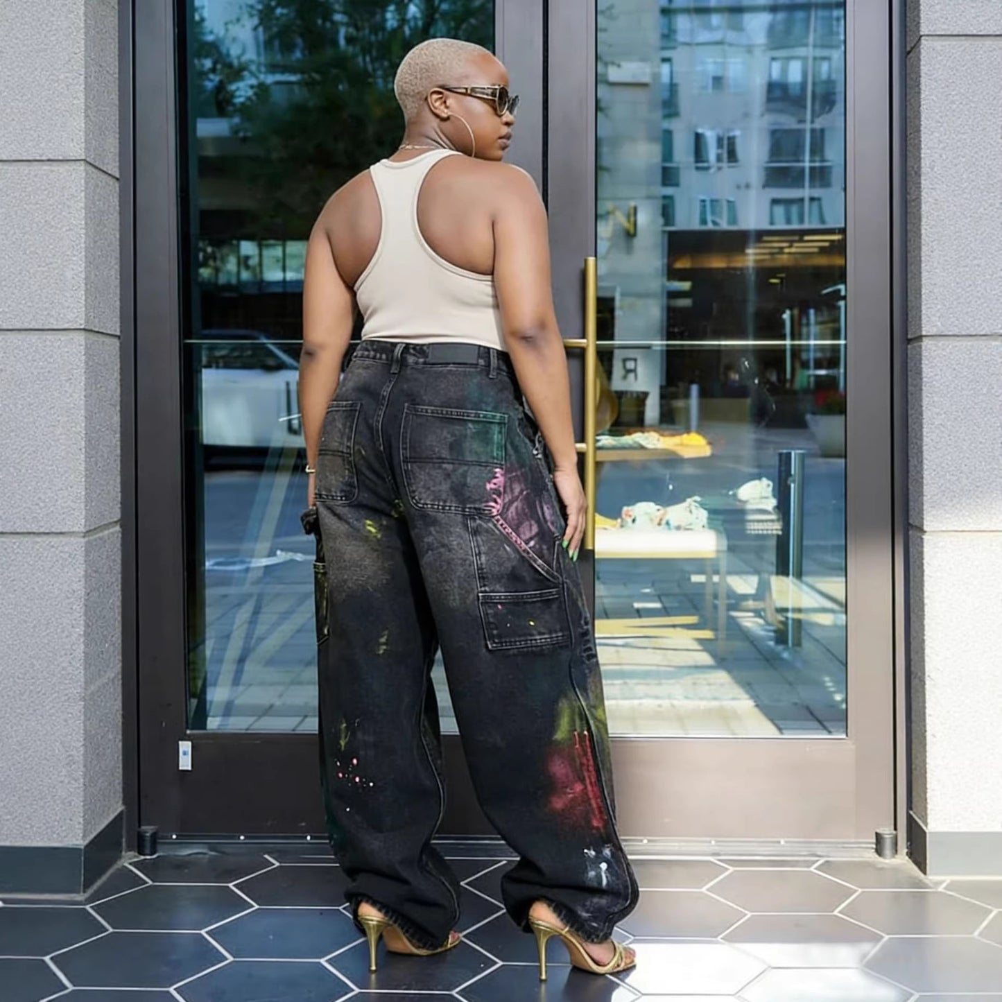 Eprolo Urban Graffiti Ripped High-Rise Jeans showing distressed denim with graffiti-style designs and a high waist fit.
