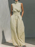 Sleeveless turtleneck top and wide-leg pants set by Trendsi, featuring a stylish, coordinated outfit with a modern silhouette.