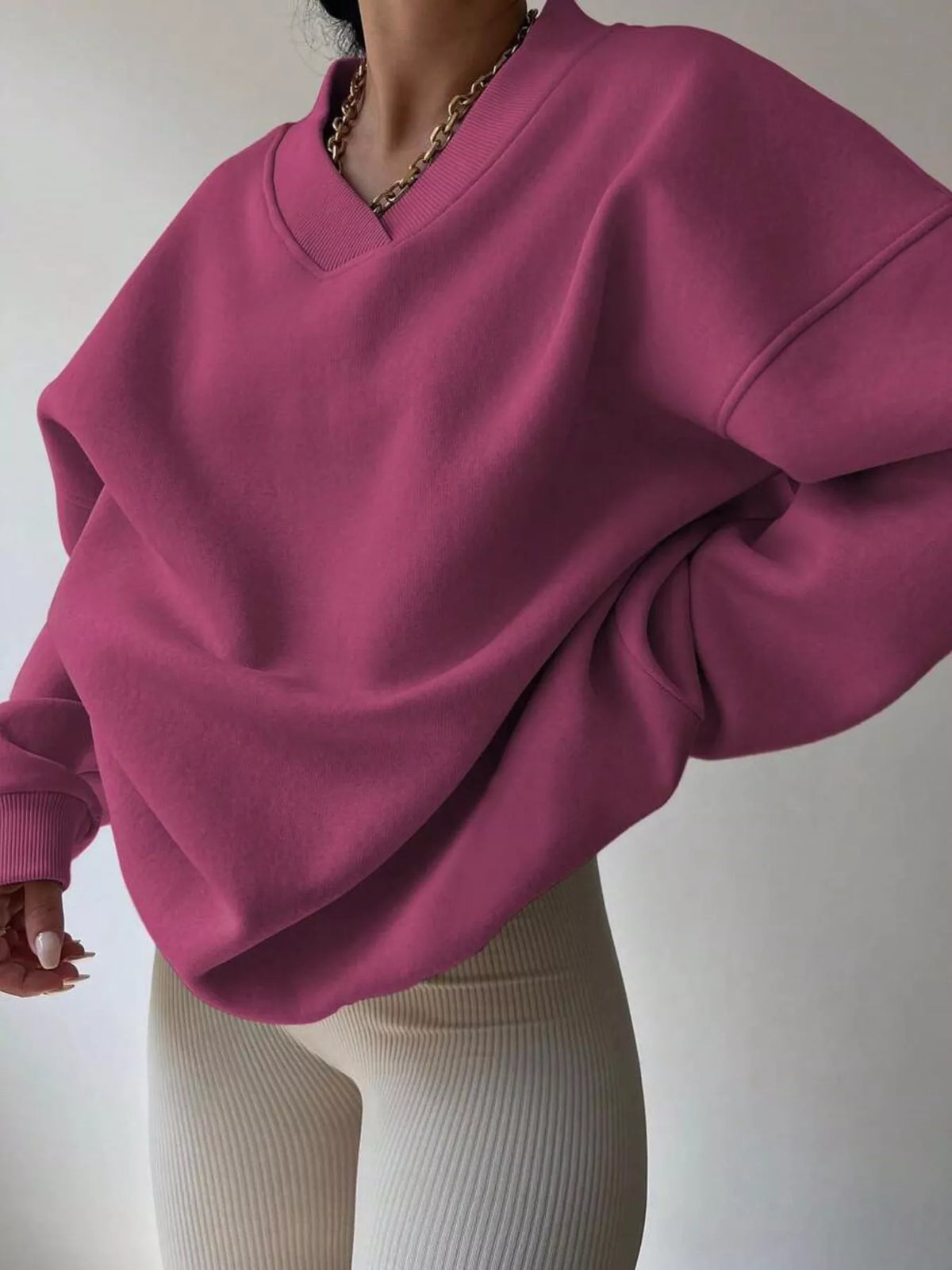 Gray dropped shoulder long sleeve oversized sweatshirt from Trendsi, with a relaxed fit and soft fabric visible in the image.