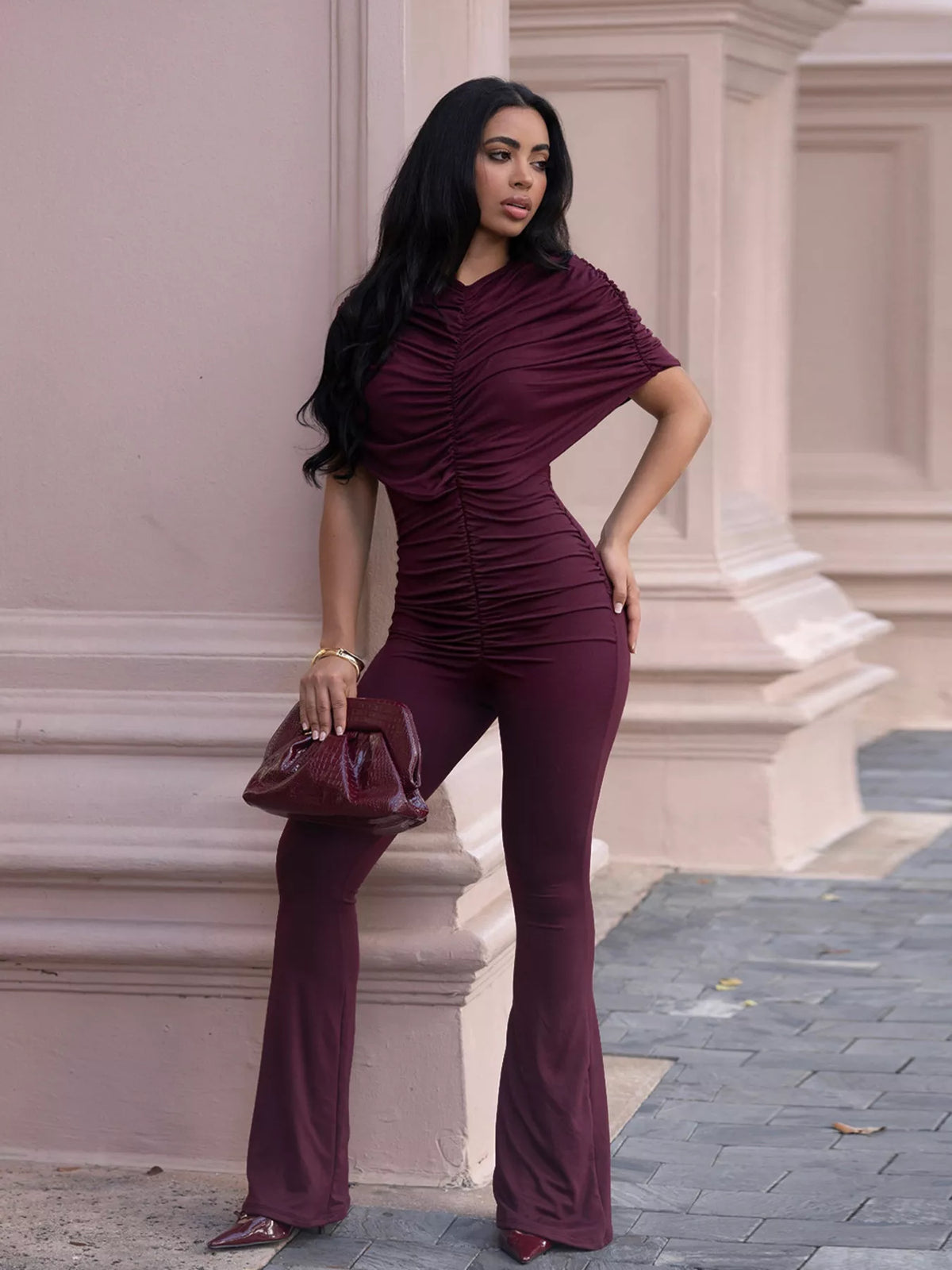 Plush Fashion Hub ruched flare leg jumpsuit with fitted bodice and wide-leg design, stylish and comfortable for casual or dressy occasions.