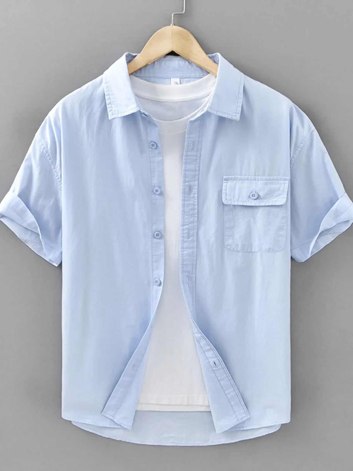Men's plus size short sleeve button-up shirt by Plush Fashion Hub, shown in a casual style with a classic collar and front buttons.
