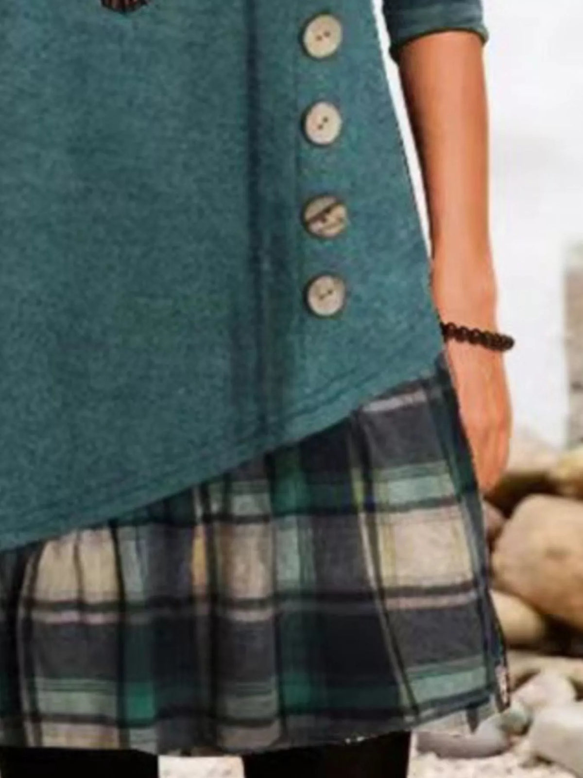 Plus size asymmetrical plaid patchwork long sleeve dress by Trendsi, featuring a stylish full-length design with unique pattern details.