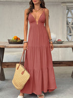 Flowy women's deep V-neck tiered maxi dress with smocked bodice, beach-inspired boho style, perfect for summer vacations.