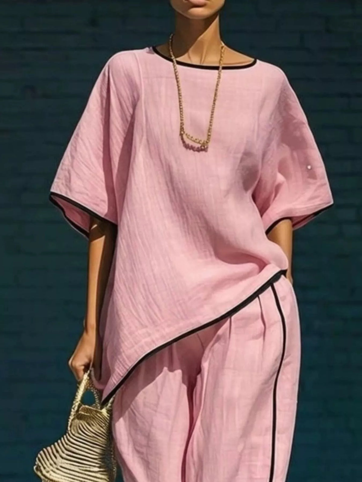 Plush Fashion Hub contrast trim round neck top and matching pants set, casual loungewear in soft fabric with stylish details.