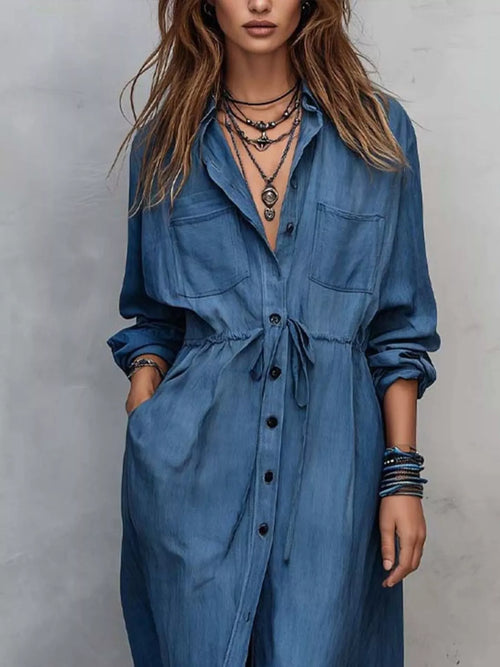 Plus size button front long sleeve dress from Trendsi, featuring a full-length shirt dress design in a stylish, comfortable fit.