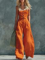 Women's retro button-front high-waist wide-leg jumpsuit by FitiqueFit, showing casualwear style with a fitted top and flowing wide-leg pants.