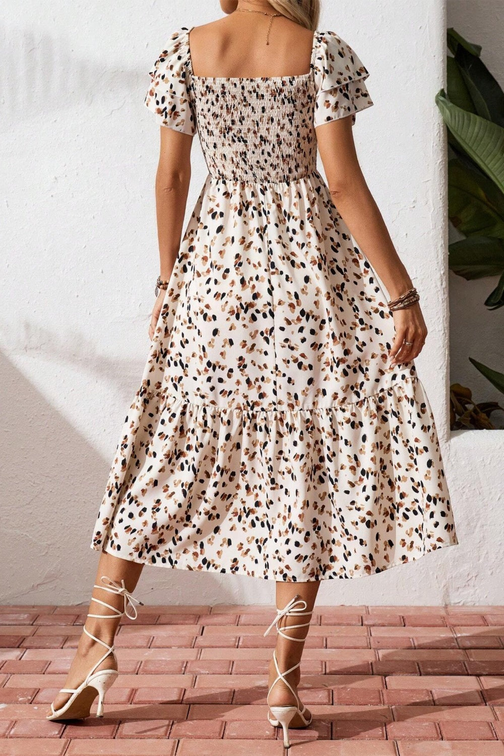 Women's square neck ruffle sleeve smocked midi dress made of cotton blend, featuring a fitted bodice and flowy skirt.