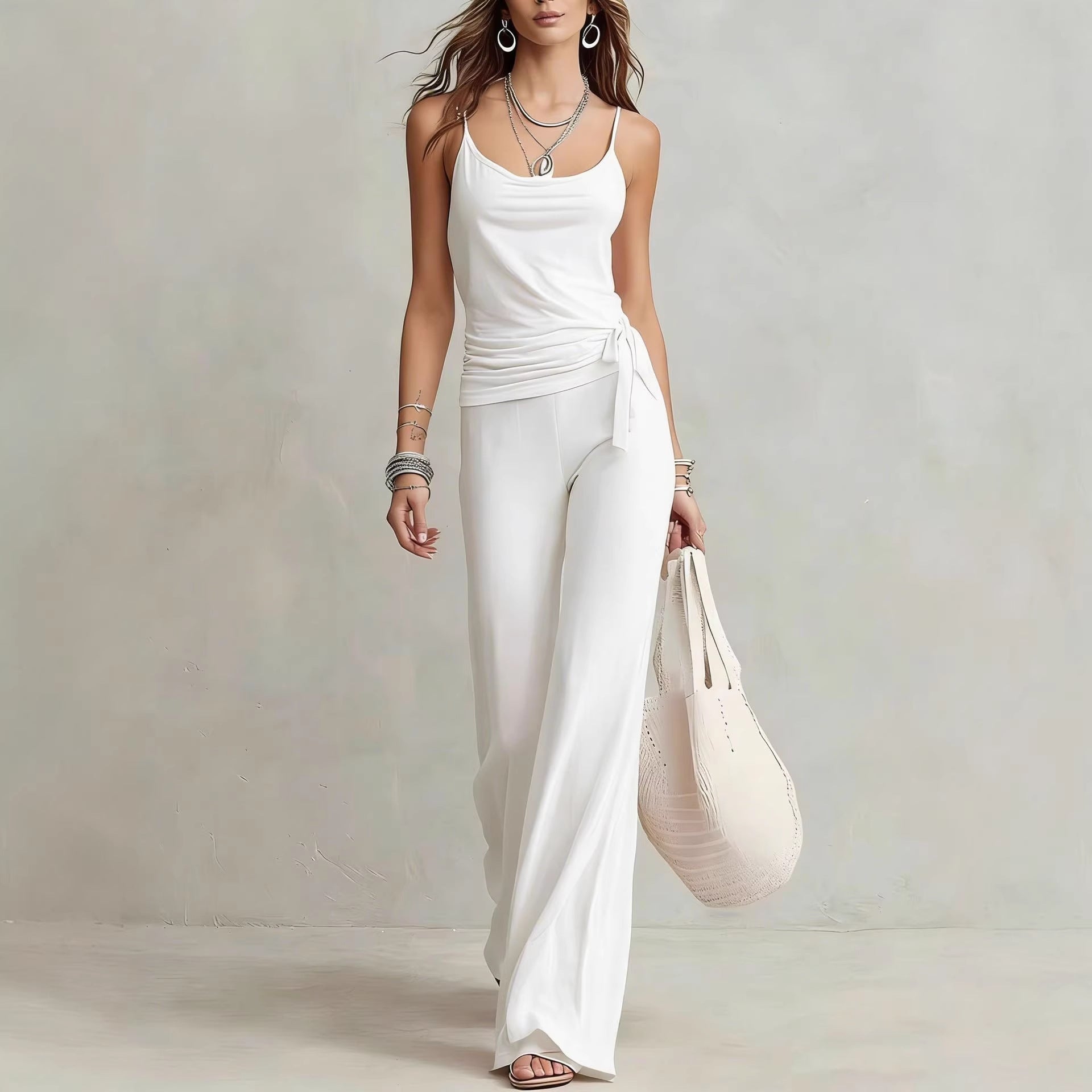 Women's solid color sleeveless top and pants two-piece casualwear set by FitiqueFit, featuring a comfortable sleeveless top and matching pants.